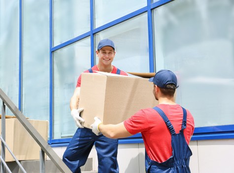 Staff observing safety procedures at a storage facility entrance