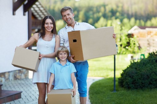 Boxes and furniture being loaded into storage at a residential property