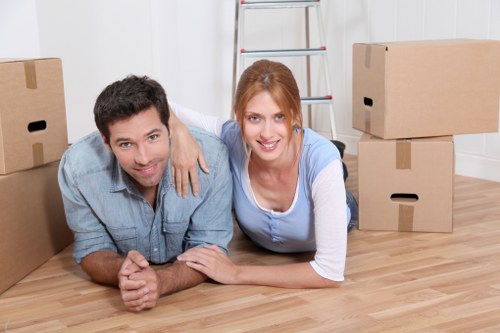 Careful packing of fragile household items by movers in Sladegreen