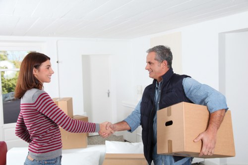 Commercial moving team handling office furniture