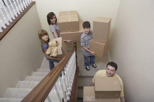 Professional moving team packing household items in Sladegreen